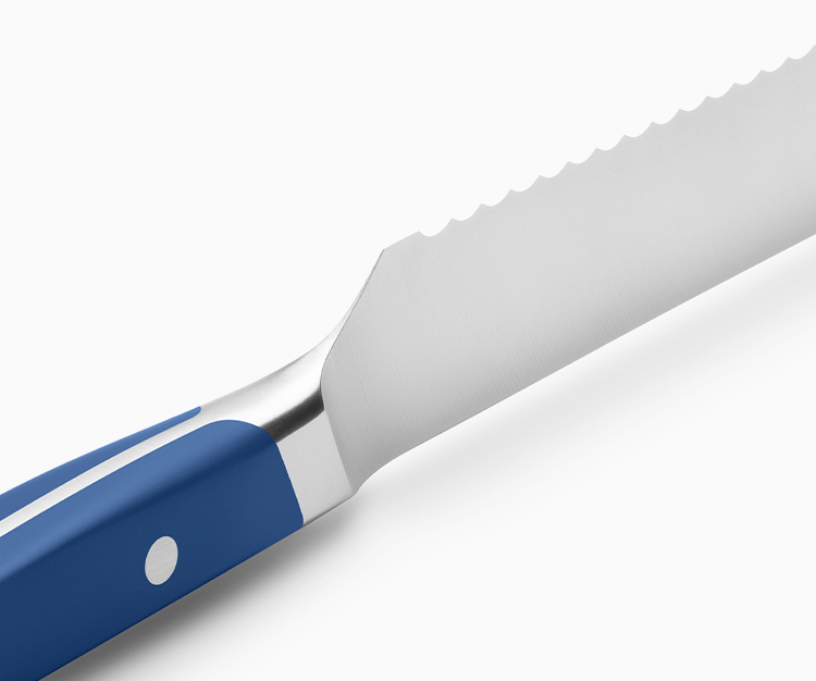 The sloped bolster on the Misen Serrated knife provides more room for your fingers to form a proper "pinch grip".
