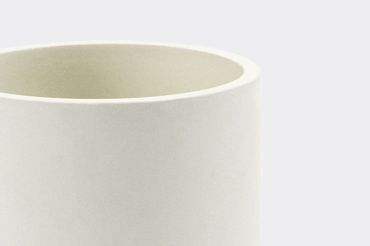 A close up view of the rim on an empty White Misen Prep Tool Holder on a white background.