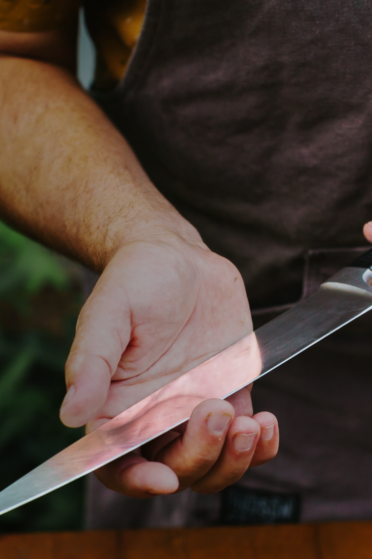Holding a freshly cleaned Misen Chef's Knife