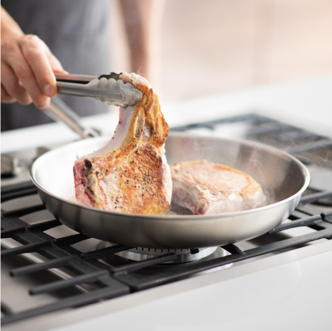 Searing pork chops in a Misen Stainless Steel Skillet