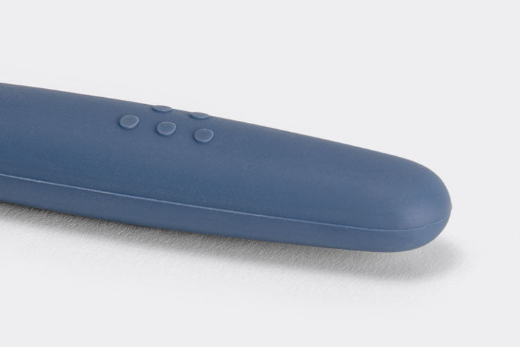 A close view of the Blue Misen Mixing Spatula’s thick silicone handle with raised Misen logo visible on a white background.