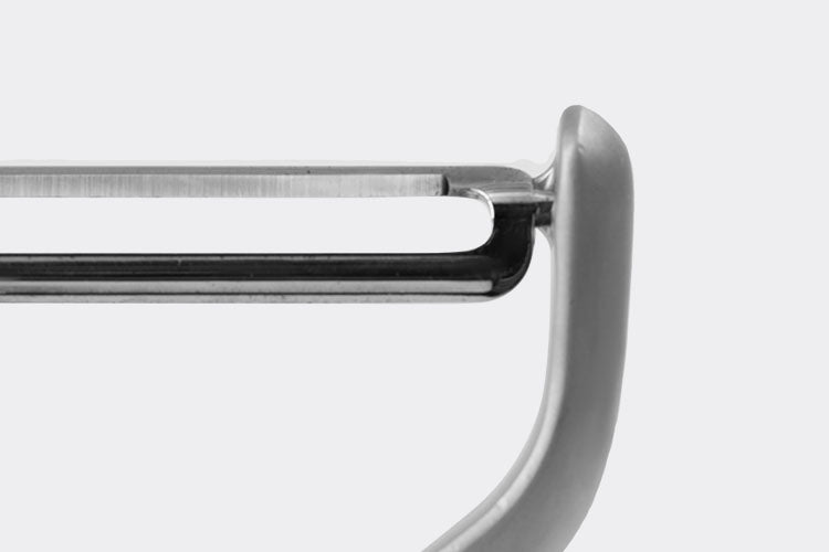 Close view of the area where the Misen Peeler’s steel blades connect to the peeler’s metal head.