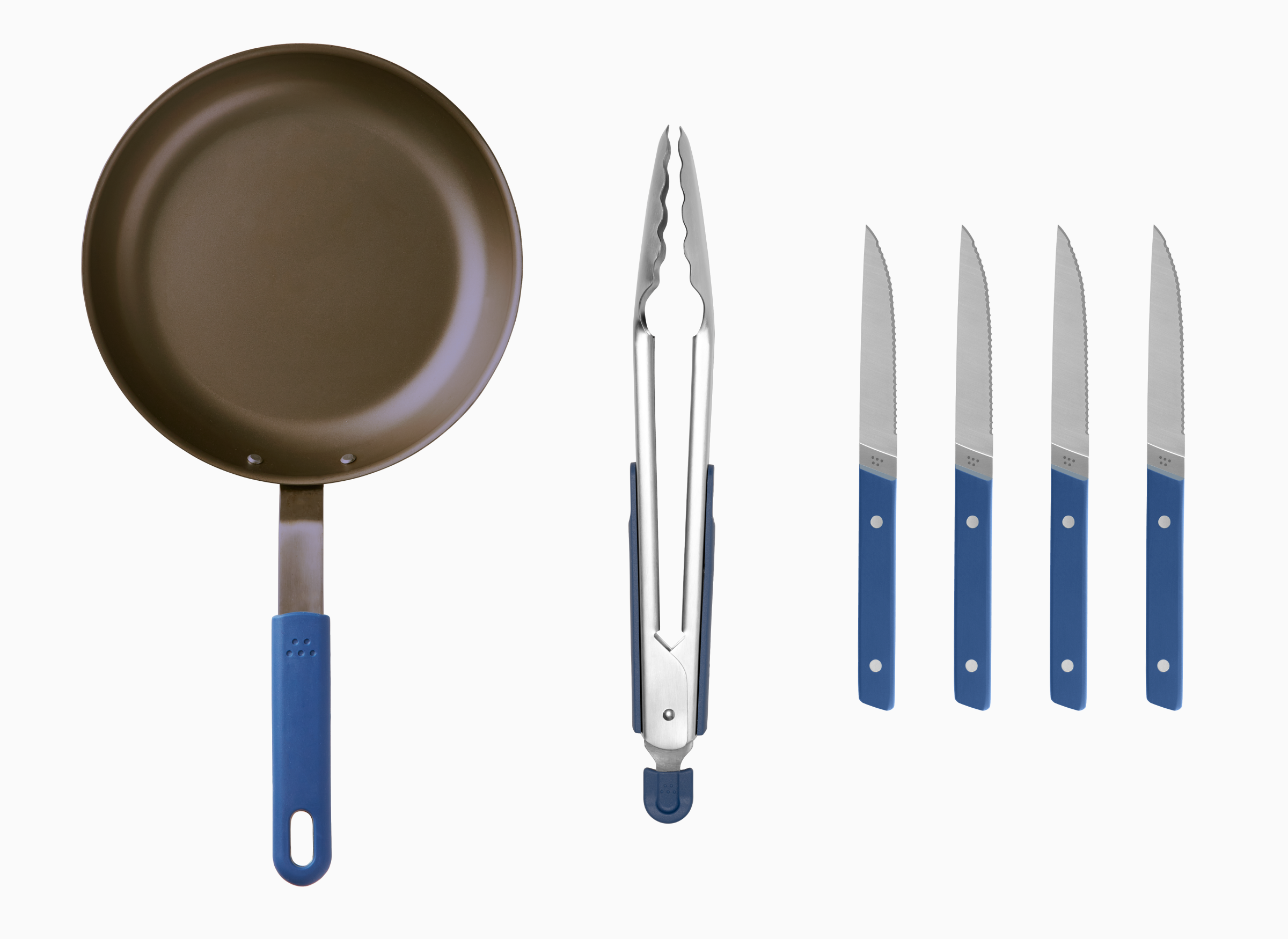 The Steak Prep Kit comes with a 10 inch Pre-Seasoned Carbon Steel Pan, a pair of blue Stainless Steel Tongs and 4 blue Steak Knives.