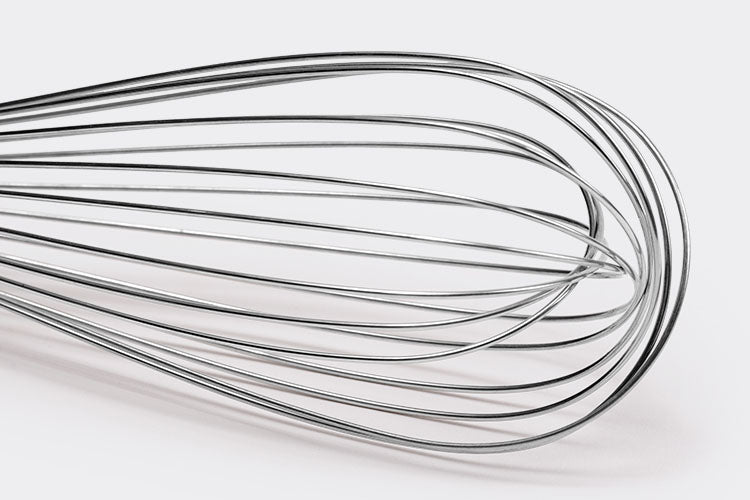 Close view of Misen Whisk’s balloon-style head, made of folded metal wires on a white background.