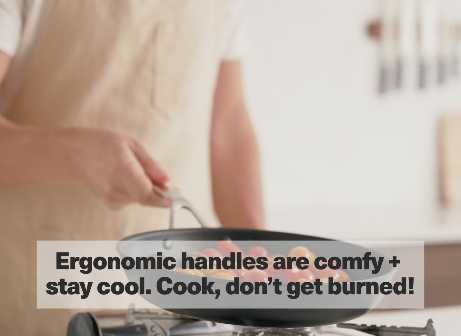 Ergonomic handles are comfy + stay cool. Cook, don't get burned!