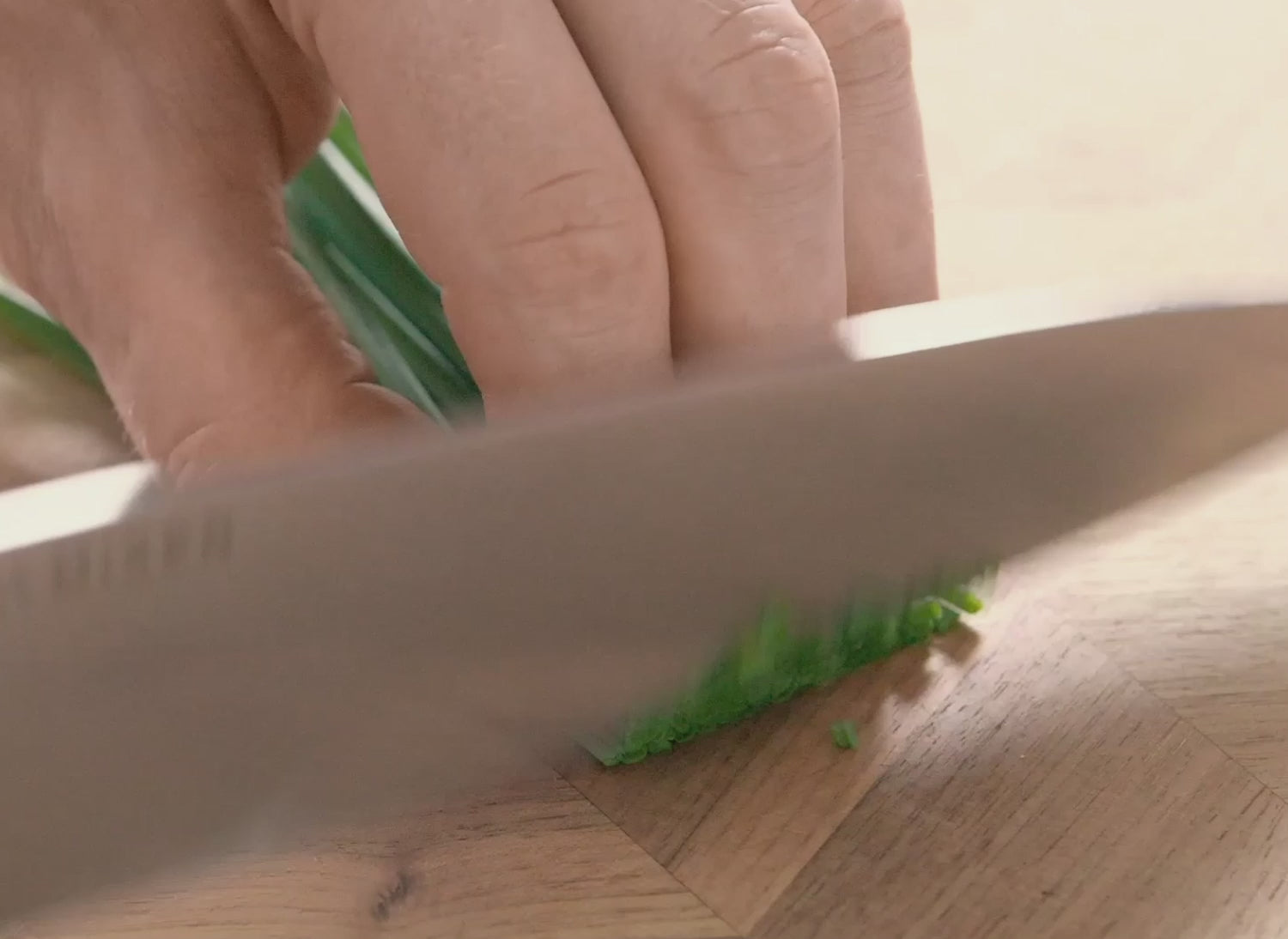 Mincing green onions with the 8 inch Misen Chef's Knife.