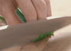 Mincing green onions with the 8 inch Misen Chef's Knife.